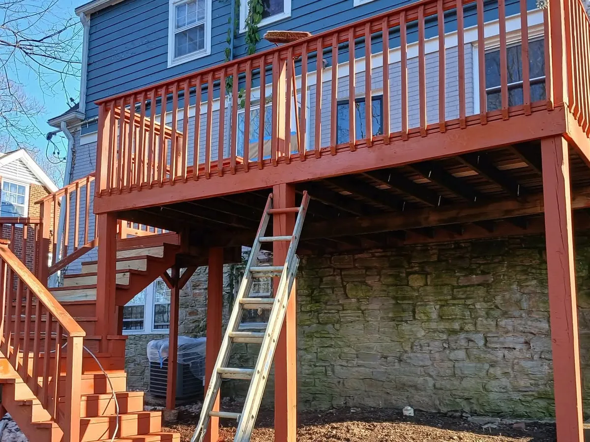 Second-story deck with stairs freshly stained