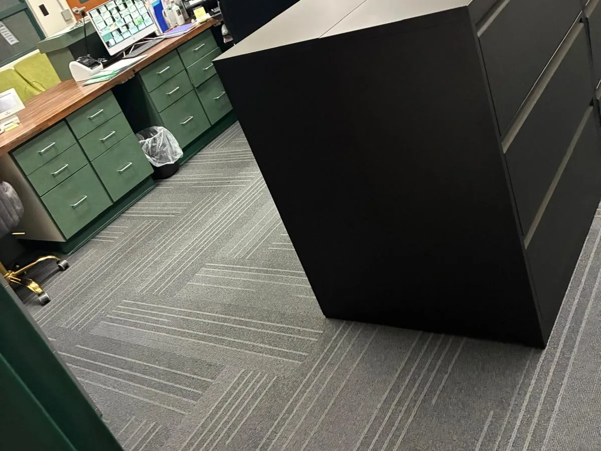 Cleaned office corner with cabinets and carpet